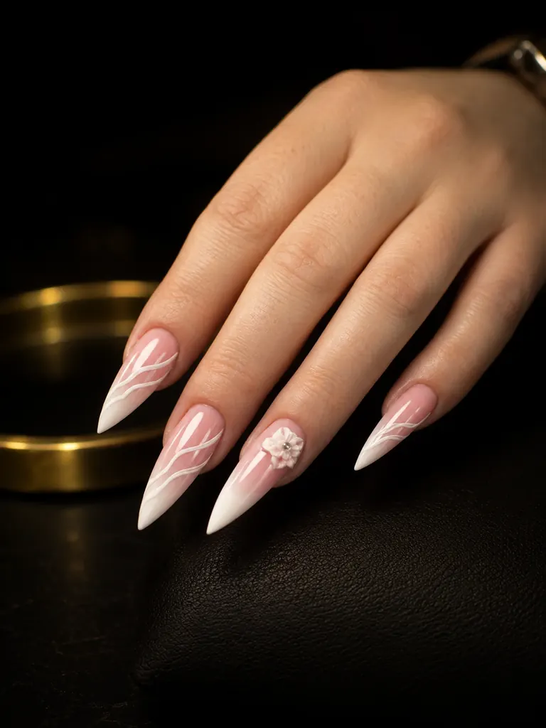 Unghii stiletto cu degrade roz-alb, linii fine albe și o floare 3D